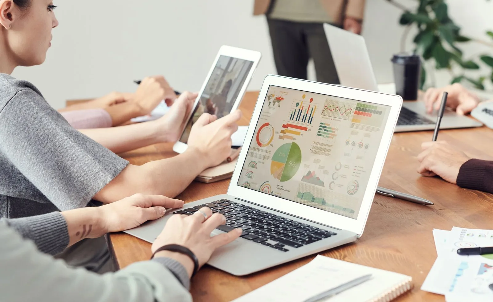 Digital marketing strategists analyzing campaign and search performance on laptops