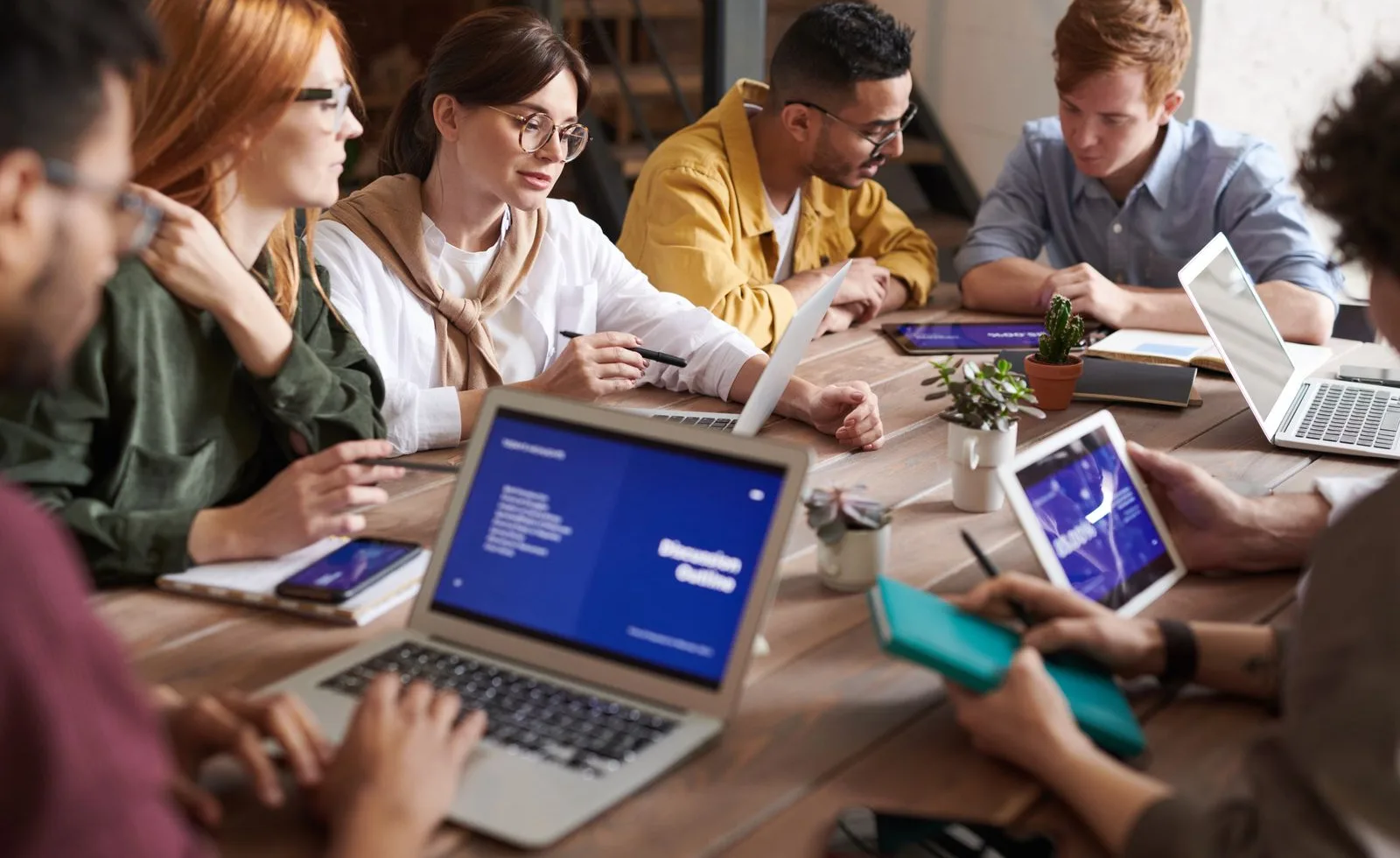 Paid search specialists planning advertising campaigns in a modern office